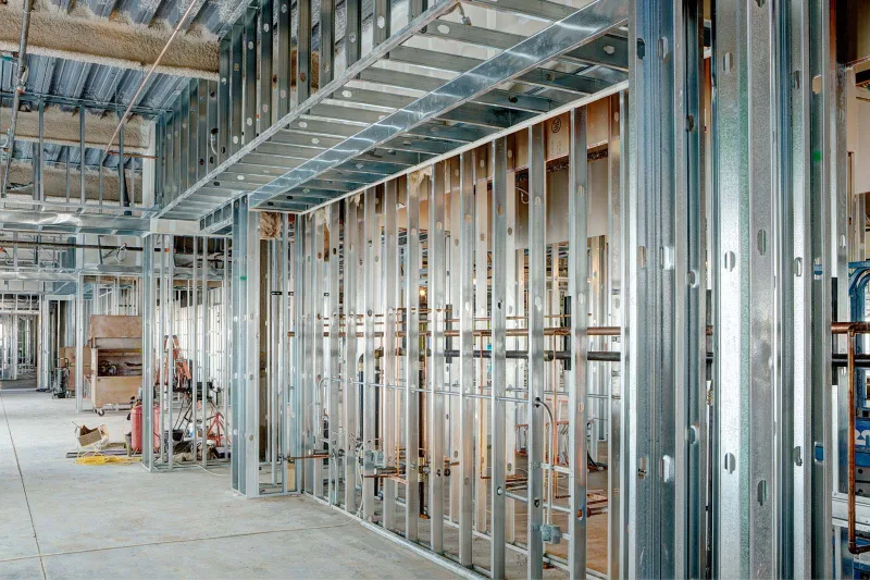 Galvanized steel stud partition walls framed in a commercial interior
