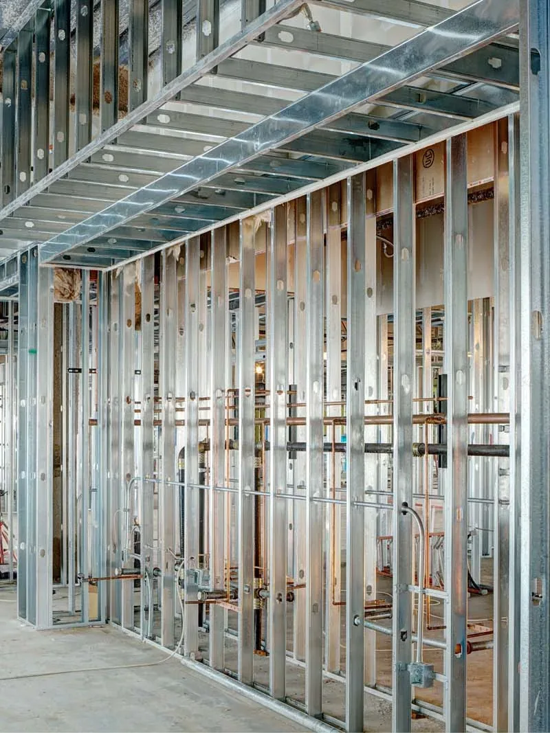 Galvanized steel stud partition walls framed in a commercial interior