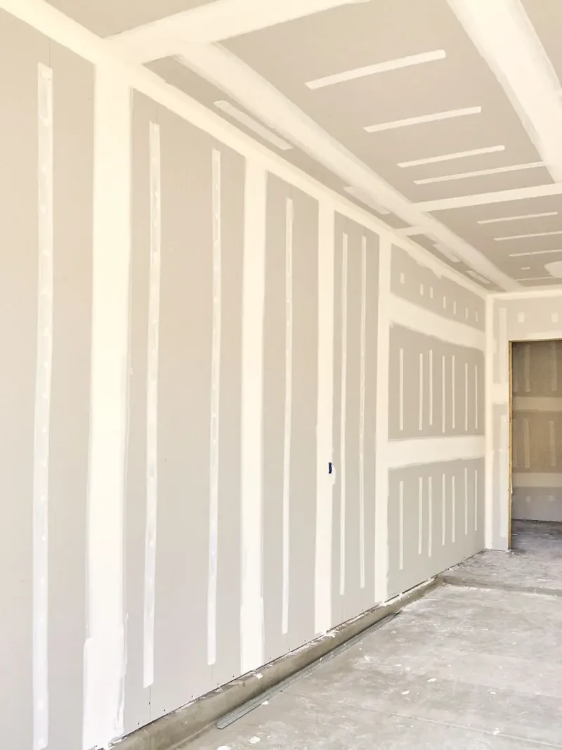 Taped and finished drywall seams on new walls and ceiling