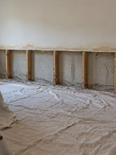 A bedroom with the lower half of one long wall opened right along its length
